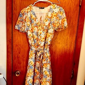 Floral dress.  Perfect for spring. Adjustable, separate sash.